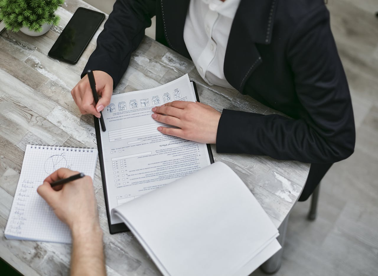 An insurance partner explains the benefits of Maryland E&O insurance to a consultant.